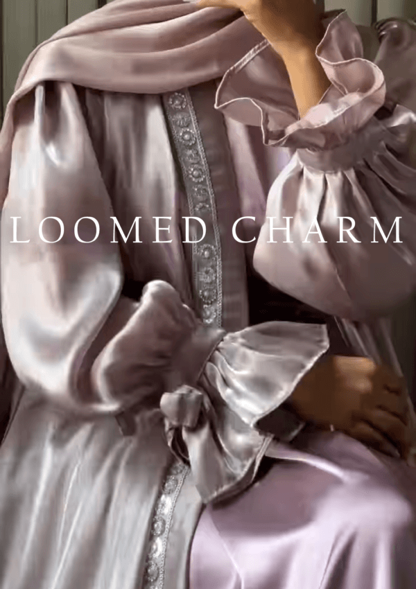 Luxurious Noya Silk Organza Shrug Abaya in soft pink with intricate crystal embellishments, featuring a satin inner, adjustable belt, and matching white chiffon scarf.