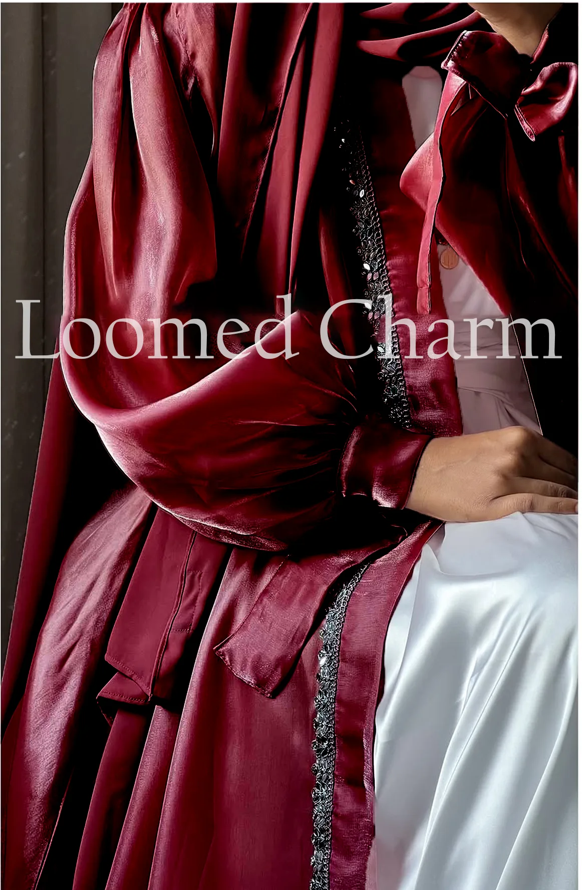 Luxurious Noya Silk Organza Shrug Abaya in soft pink with intricate crystal embellishments, featuring a satin inner, adjustable belt, and matching white chiffon scarf.