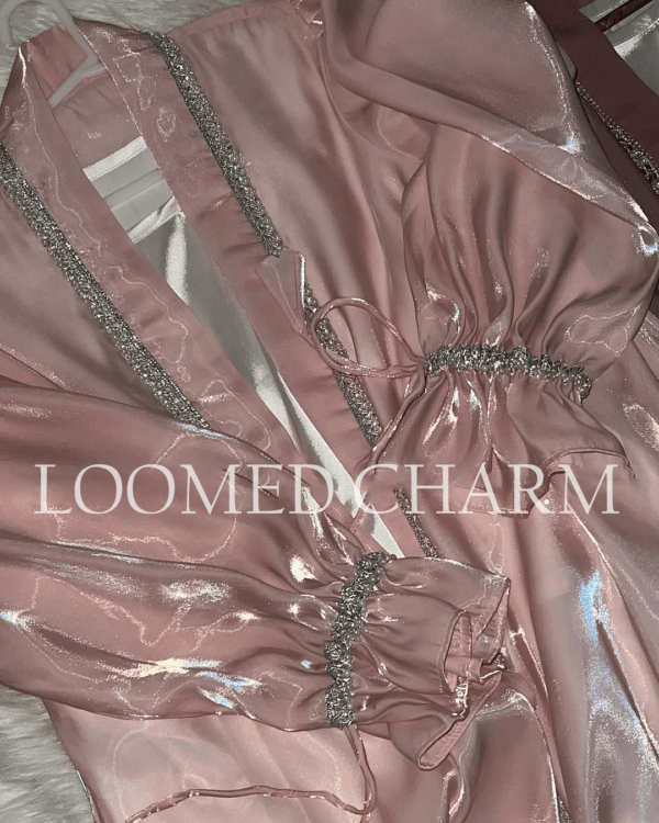 Luxurious Noya Silk Organza Shrug Abaya in soft pink with intricate crystal embellishments, featuring a satin inner, adjustable belt, and matching white chiffon scarf.